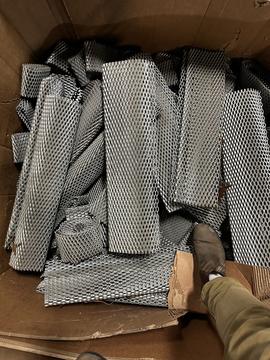 Efficient Scrap Metal Recycling: Corrugated Metal Sheets in Cardboard Box